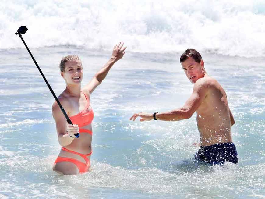 Eugenie-Bouchard-trying-to-take-selfie-with-a-friend-in-swimsuit