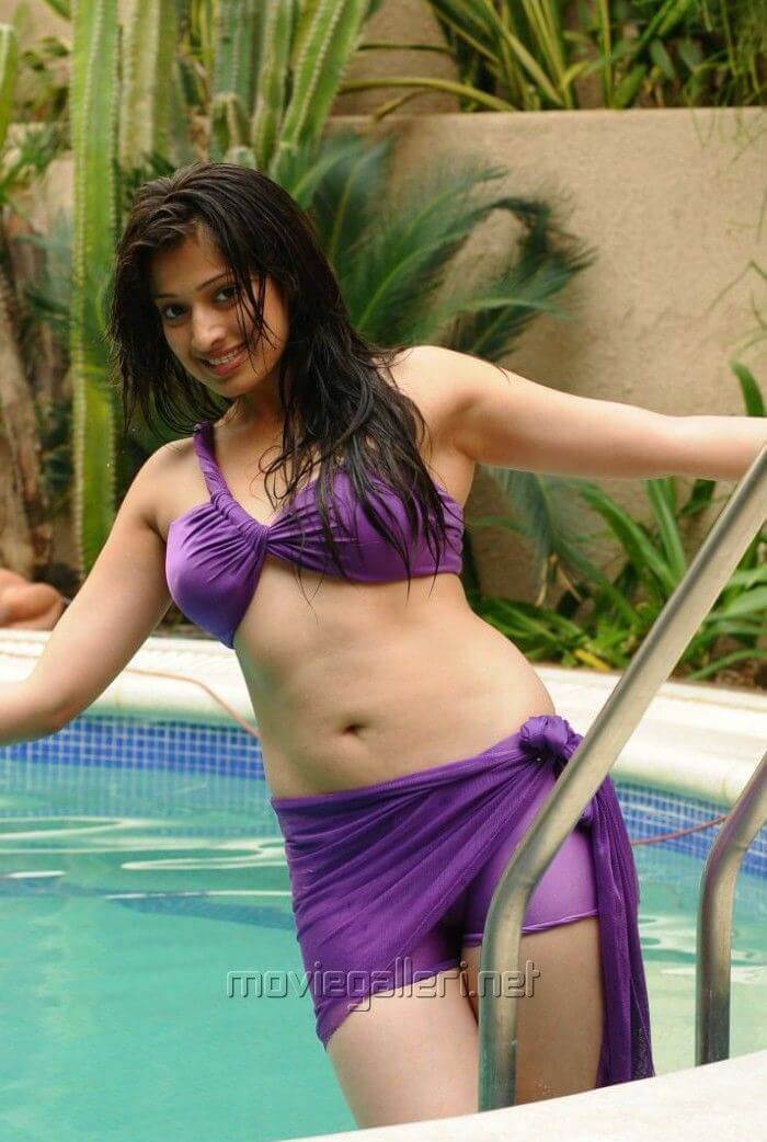 Raai Laxmi having fun in swimming pool in blue bikini