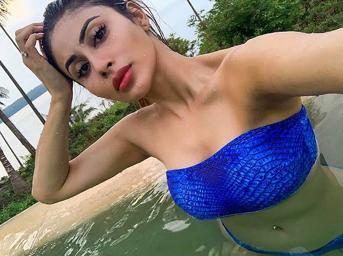 mouni-roy-hot-pictures-in-blue-bikini-clicking-selfie-in-pool