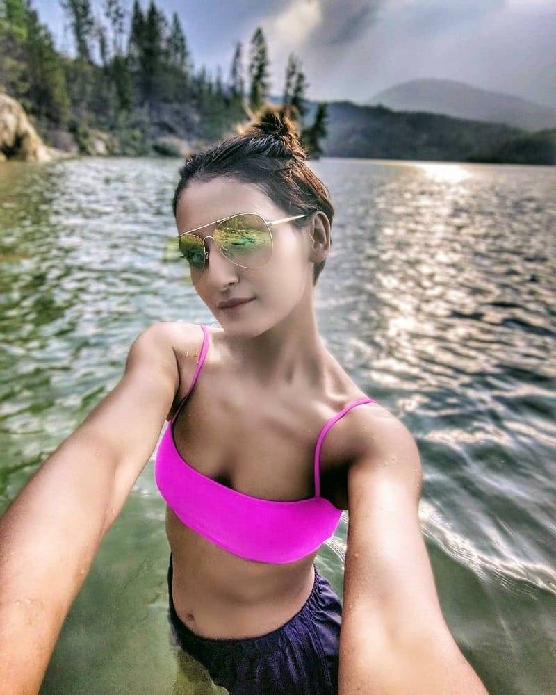Shakti-Mohan-wearing-bikini-top-taking-selfie-in-sea-water