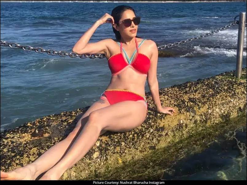 bollywood-hot-actress-nusrat-bharucha-wearing-red-bikini-raising-the-temperature