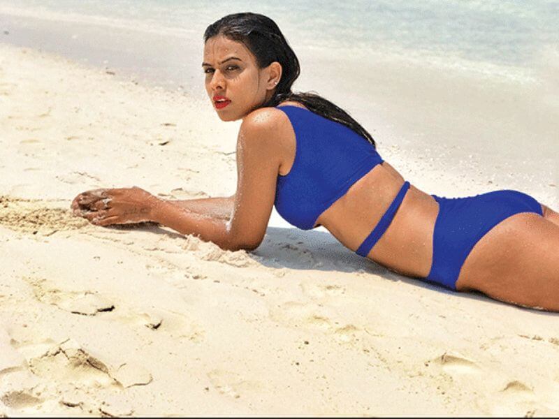 nia-sharma-butt-images-in-bikini-lying-on-beach