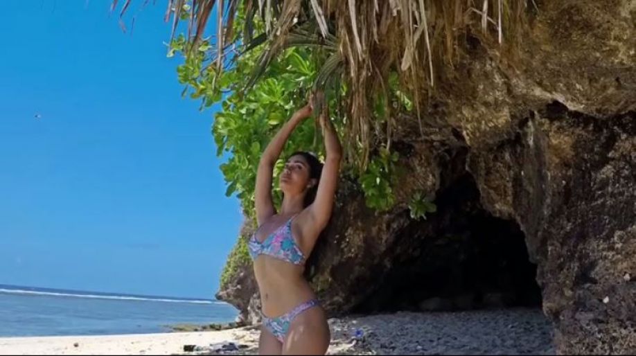 actress-tridha-choudhury-bikini-photos-while-doing-yoga-on-beach