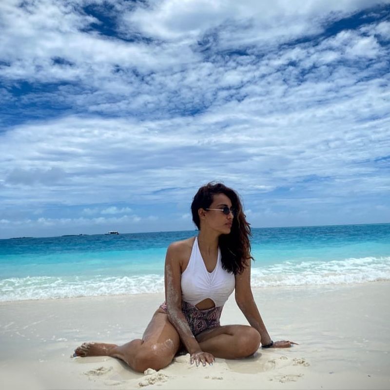 Surbhi-Jyoti-bikini-photos-sitting-on-beach-sand
