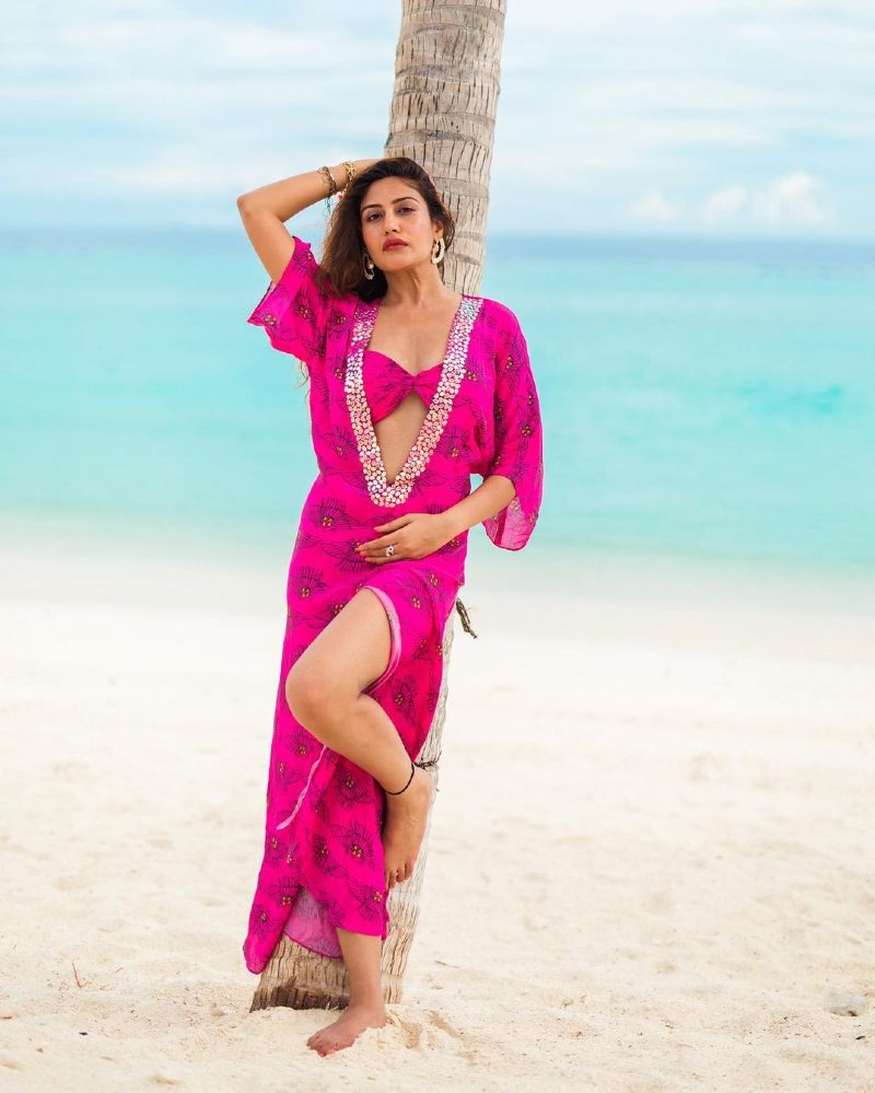 surbhi-chandna-posing-in-bikini-bra-with-printed-gown-on-beach-side
